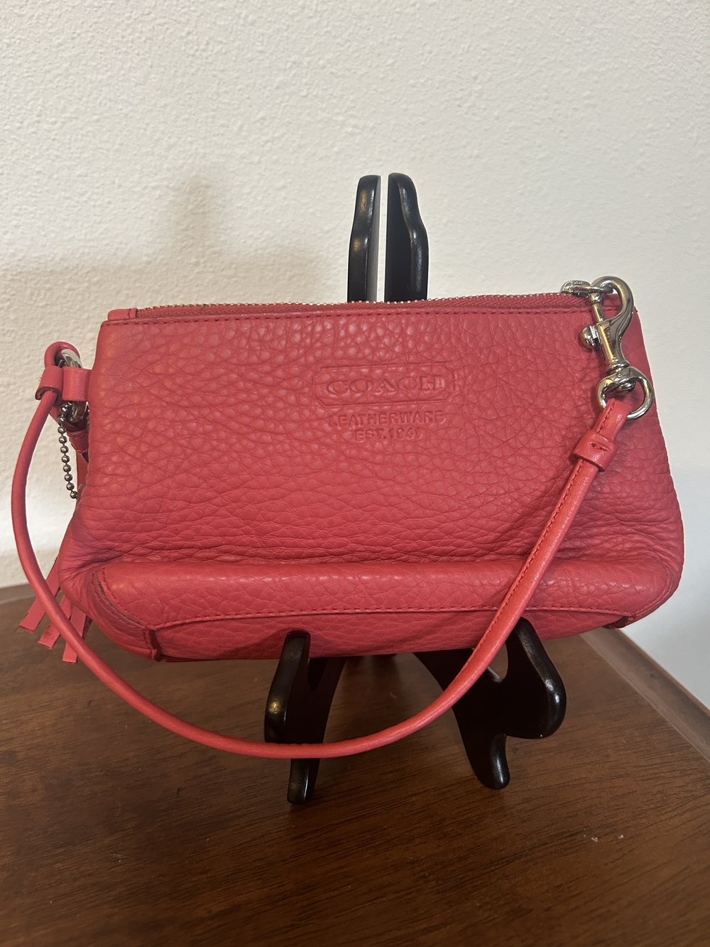 Coach Pebbled Leather Wristlet in Coral